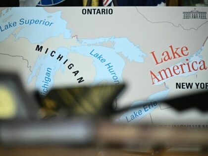 A map is displayed as US President Donald Trump signs an executive order that aims to rena