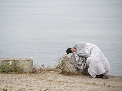 CEUTA, SPAIN - JULY 31: Hundreds of migrants attempt to swim from Morocco to the Spanish c
