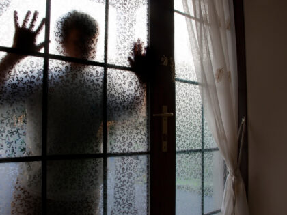 silhouette outside door or window