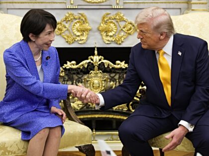 WASHINGTON, DC - MARCH 19: Prime Minister of Japan Sanae Takaichi (L) shakes hands with U.