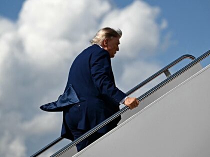 US President Donald Trump boards Air Force One at Joint Base Andrews, Maryland, on August