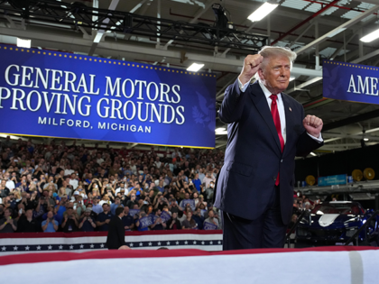 President Donald Trump greets supporters after speaking at General Motors’ Milford Provi