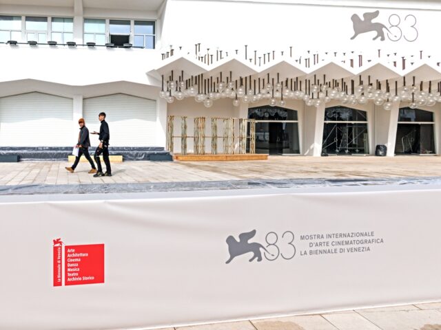 VENICE, ITALY - 11 MARCH: Workers walk at the Venice Film Festival on the Lido on 11 March