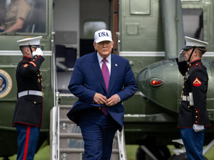 President Donald Trump departs Marine One before delivering remarks at Fort Bragg, North C