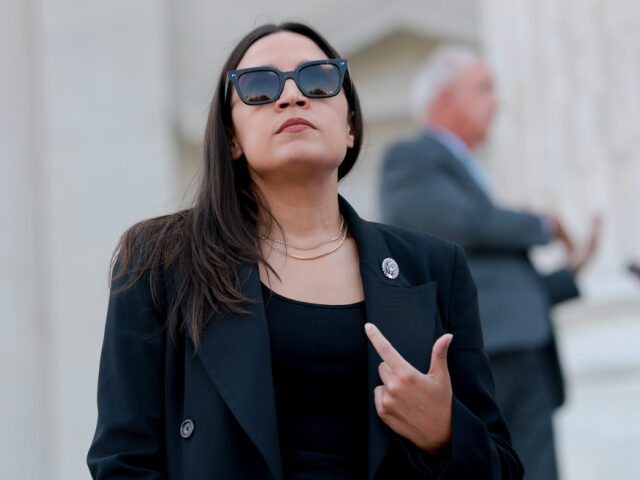AOC and God U.S. Rep. Alexandria Ocasio-Cortez (D-NY) speaks to reporters on the House steps after a s