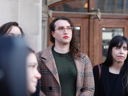 U.S. Army Sgt. 1st Class Sierra Moran, a transgender service member, listens during a pres