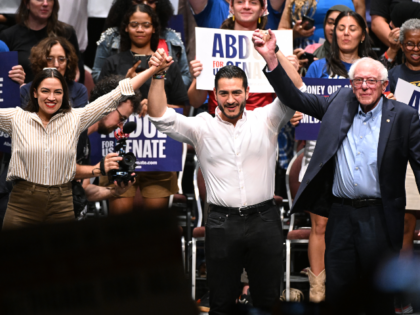 From left foreground, U.S. Rep. Alexandria Ocasio-Cortez, D-N.Y., Michigan Democratic U.S.