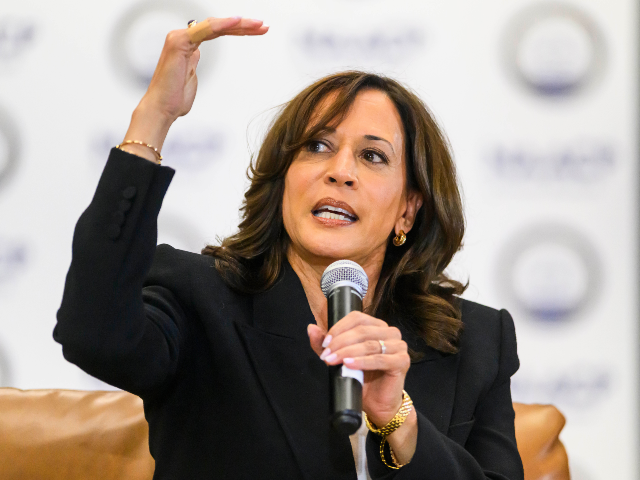 AP26266032474289 Former Vice President Kamala Harris speaks with the Rev. Wendell Anthony, President of the