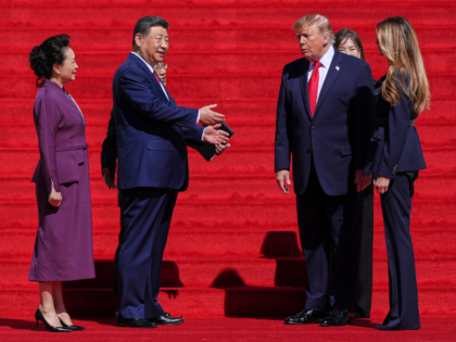 President Donald Trump, center right, and first lady Melania Trump, right, speak with Chin