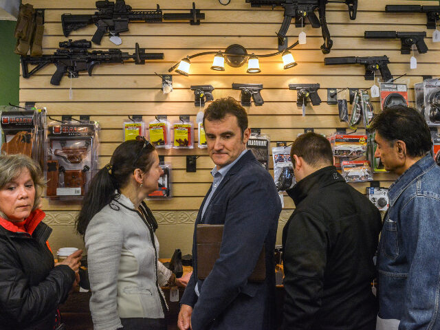 Busy gun store Customers browse in Dennis Pratte's controversial gun store, Nova Armory, which opens