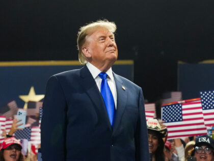 U.S. President Donald Trump walks on stage to speak on the first day of the 2026 Republica