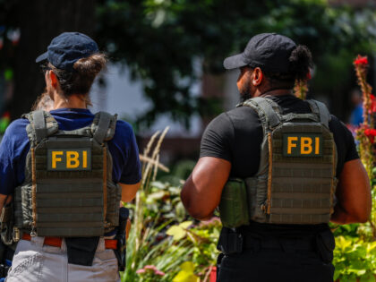 An FBI agent and a Metropolitan Police Department (MPD) officer arrest a man near the Whit