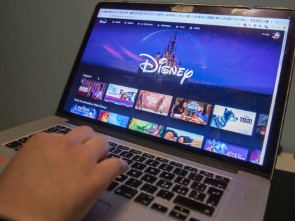 Turin, Italy 24 March 2020. A girl watches the new DisneyChannel streaming channel during