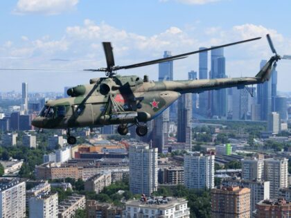 MOSCOW, RUSSIA - JUNE 24: Mil Mi-8 military helicopters fly over Red Square during the Vic