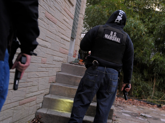 GettyImages-141218202 WASHINGTON, DC - JANUARY 4: Deputy U.S. Marshals Willard King, left, and Raymond Brown sur