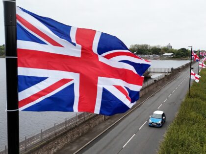 The flag of the United Kingdom and the Flag of St George hang from lamposts in Birmingham.