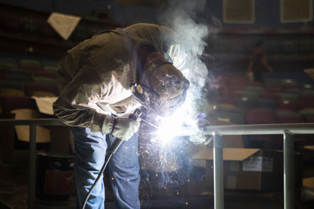 SAN ANTONIO, TEXAS - JUNE 13: Elberth Tobias welds a railing at Magik Theatre in San Anton