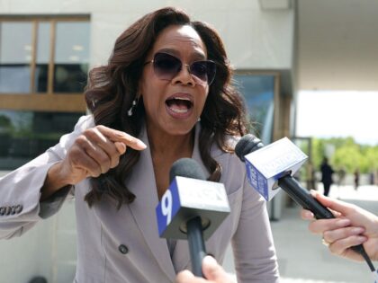 Oprah Winfrey gives an interview as she attends the dedication ceremony for the opening of