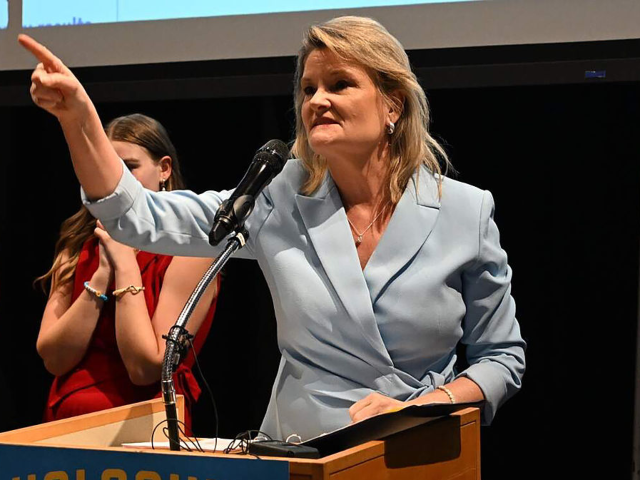 Kansas state Sen. Cindy Holscher, D-Overland Park, speaks to a crowd of supporters at a wa