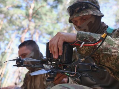 Soldiers from the 13th Khartiia Brigade of Ukraine's National Guard improve their FPV dron