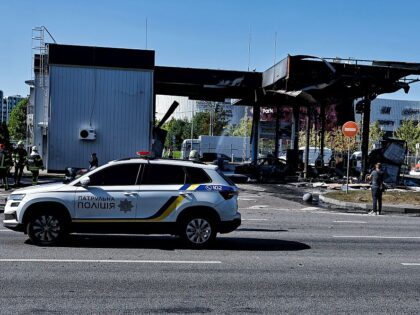 KYIV, UKRAINE - SEPTEMBER 10: A police car stands in front of a gas station charred by a R