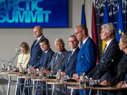 14 September 2026, Finland, Rovaniemi: Chancellor Friedrich Merz (CDU, center) stands next
