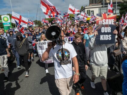 PORTSMOUTH, ENGLAND - SEPTEMBER 12: Demonstrators participate in an anti-migrant protest m
