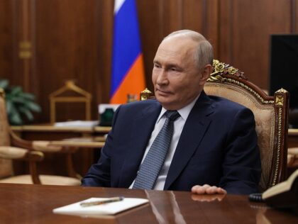 In this pool photograph distributed by the Russian state agency Sputnik, Russia's Pre