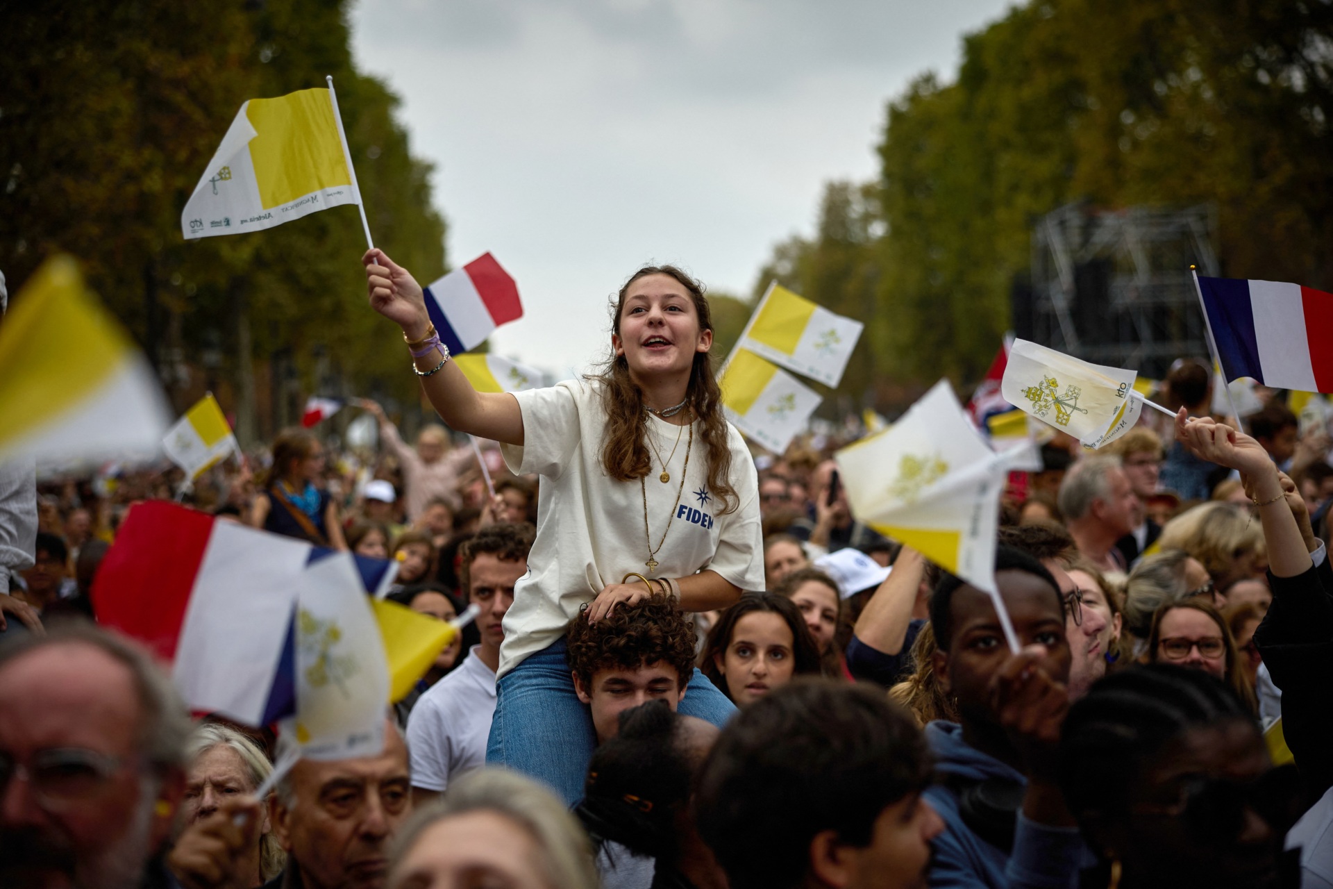 Worshippers gathered on the Champs-Elysees Avenue attend a solemn outdoor mass celebrated by Pope Leo XIV at Place de la Concorde, central Paris, on September 26, 2026 on the second day of his visit to France. Pope Leo XIV celebrates an open-air mass for hundreds of thousands of believers on the Champs Elysees in Paris, after saying it was possible to "live together in dignity and peace". (Photo by Kiran RIDLEY / AFP via Getty Images)