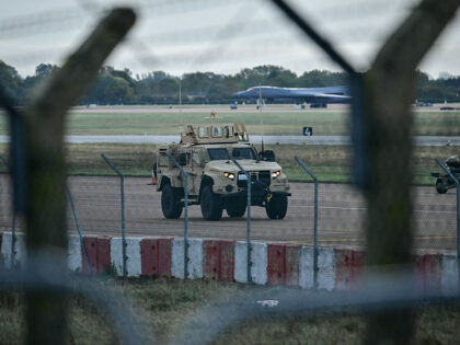 An armoured vehicle (C) patrols the interior at RAF Fairford base in Fairford, south-west
