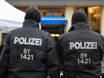 Policemen stand guard in front of the Bayerischer Hof hotel, the location for the 54th Mun