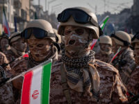 An Islamic Revolutionary Guard Corps armed personnel looks on while waiting to participate in a military rally in downtown Tehran, Iran, on January 10, 2025. The IRGC spokesperson says on Monday, January 6, that the military rally named Rahian-e-Quds (Passengers of Al-Aqsa) includes 110,000 IRGC members. (Photo by Morteza Nikoubazl/NurPhoto via Getty Images)