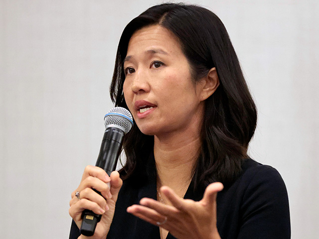 headline: Boston Mayor Michelle Wu Pays Illegals $575 to Tak