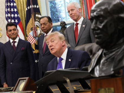 U.S. President Donald Trump answers questions from reporters while making an announcement