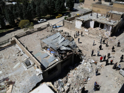 An aerial view of damaged residential buildings in the Vahdat neighborhood following recen