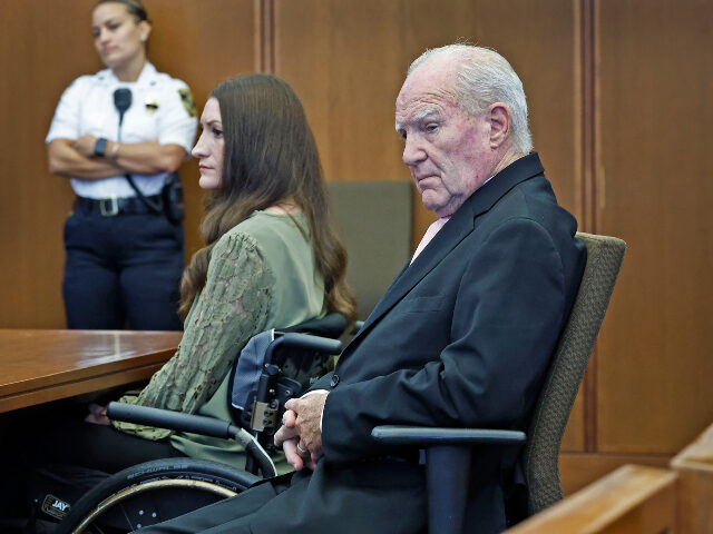 Lindsay Clancy and lawyer Kevin Reddington look at jurors as Judge William Sullivan instru