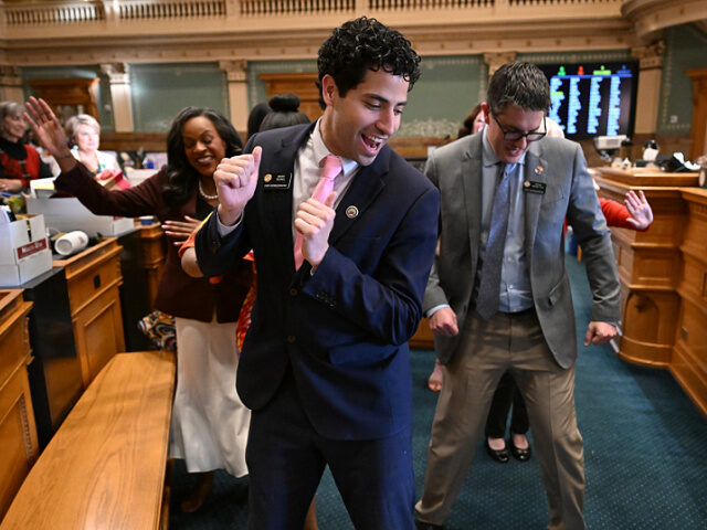 Manny-Rutinel-Colorado-dancing-fileMay24-getty DENVER, CO - MAY 8: Colorado representatives do the Electric Slide dance during a recess o