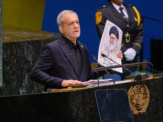 (EDITOR'S NOTE: Alternate Crop) President of Iran Masoud Pezeshkian holds up a poster