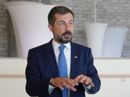 Former Transportation Secretary Pete Buttigieg speaks to reporters after speaking at the S