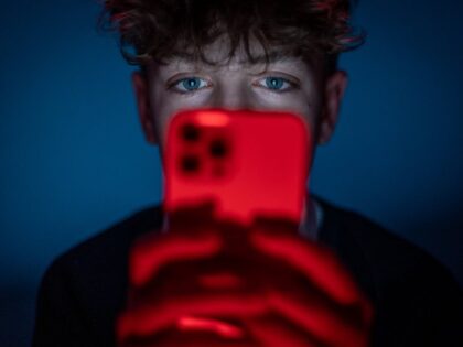 Teenager doom scrolling TikTok