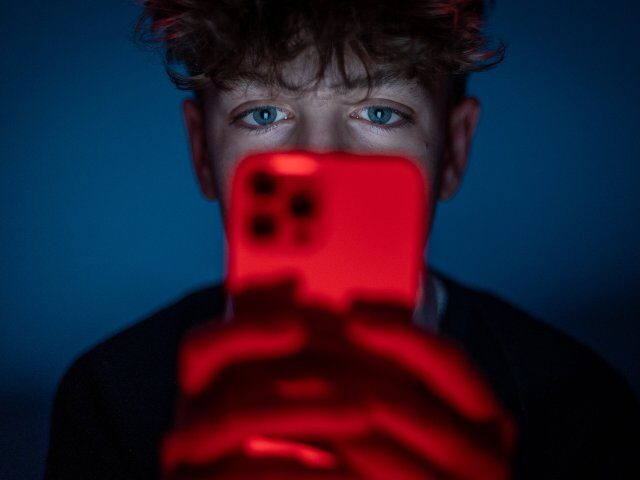 Teenager doom scrolling TikTok