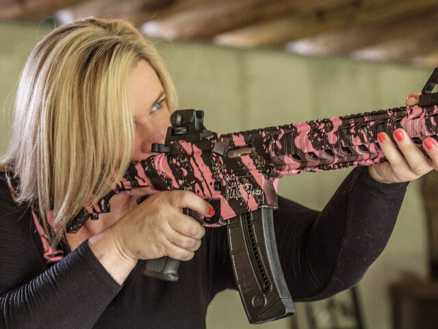 Woman with AR-platform rifle In this photo taken June 24, 2016, Dara Humphries, an NRA and Glock firearms instructor, p