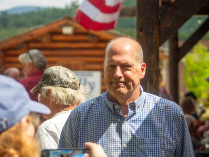 A supporter snaps a photo of former Sen. John E. Sununu as he campaigns for the GOP nomina