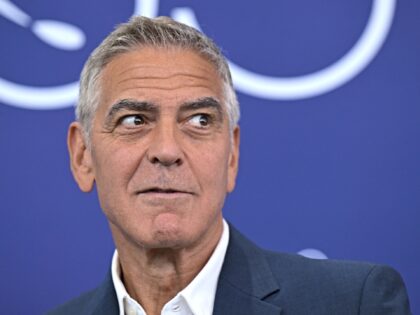 US actor and filmmaker George Clooney poses during a photocall at the 83rd International V