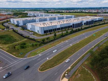 FILE - Cars drive past data centers on July 16, 2023, in Ashburn, Va. (AP Photo/Ted Shaffr