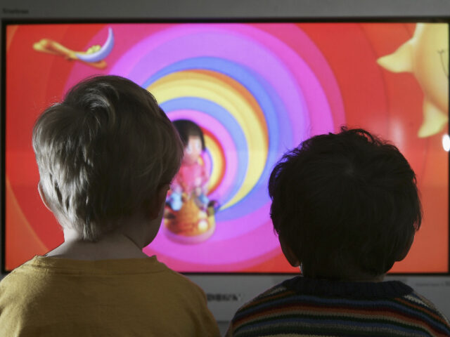 netflixflorida LONDON - JANUARY 27: In this photo illustration two young child watch television at home,