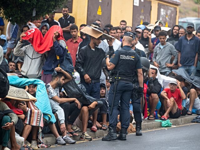 CEUTA, SPAIN - SEPTEMBER 01: Several National Police officers are managing the queues of m