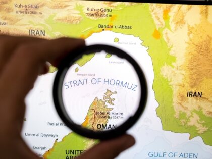 A map shows the Strait of Hormuz on a laptop computer screen in this photo illustration in