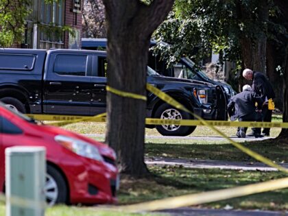 Toronto, ON - September 21: Spray from buckshot can be seen on the side of a vehicle where