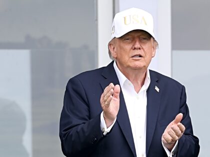 DOONBEG, IRELAND - SEPTEMBER 12: U.S. President Donald Trump applauds as he looks across t